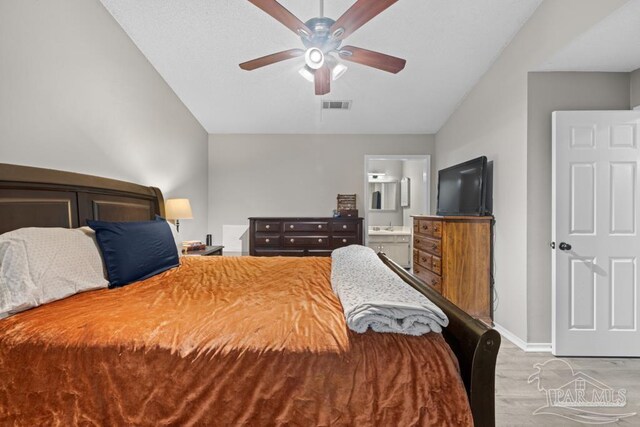 4546 Northpointe Pl, Pensacola, FL 32514 - bedroom with lofted ceiling, baseboards, ensuite bath, and a ceiling fan