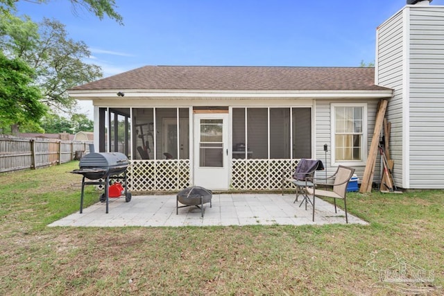 4546 Northpointe Pl, Pensacola, FL 32514 - back of property featuring a sunroom, an outdoor fire pit, a patio, and a shingled roof