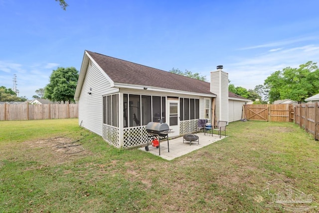 4546 Northpointe Pl, Pensacola, FL 32514 - back of house with a sunroom, a fire pit, a patio area, roof with shingles, and a gate