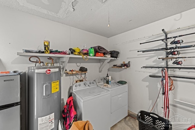 4546 Northpointe Pl, Pensacola, FL 32514 - laundry room featuring water heater, washer and dryer, and a textured ceiling