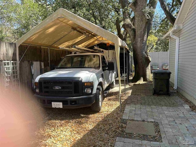8714 Figland Ave, Pensacola, FL 32534 - view of parking with a detached carport
