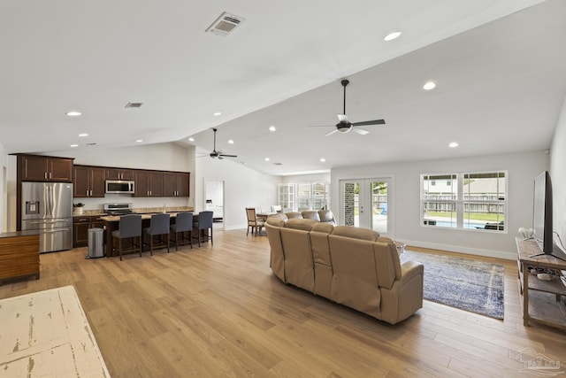 living room with ceiling fan, light wood finished floors, lofted ceiling, recessed lighting, and baseboards