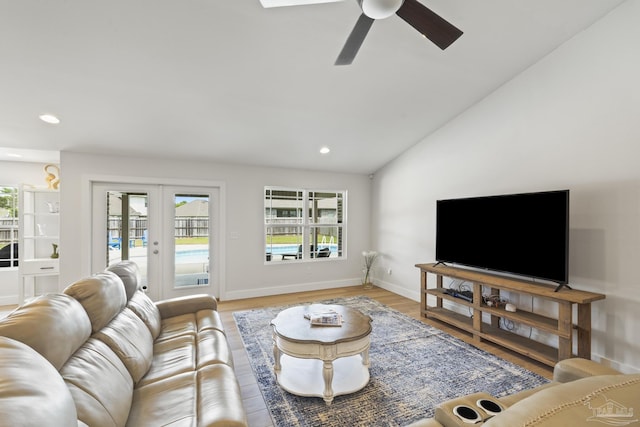 living area with french doors, a ceiling fan, baseboards, vaulted ceiling, and recessed lighting