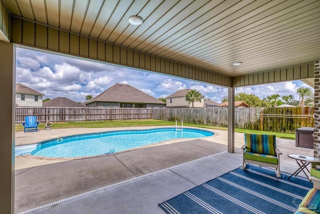 view of swimming pool with a patio area and a fenced backyard
