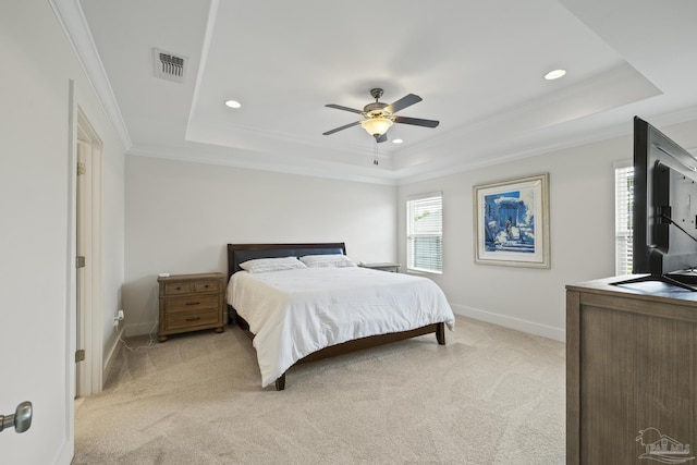 bedroom with a raised ceiling, light colored carpet, ornamental molding, baseboards, and recessed lighting