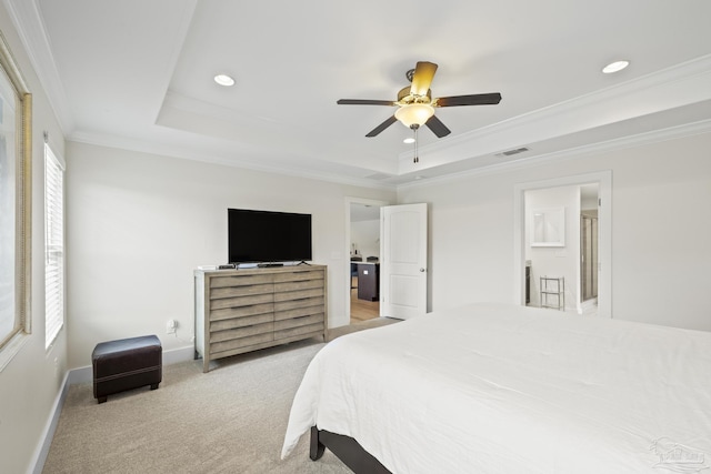 bedroom with a tray ceiling, ornamental molding, light carpet, recessed lighting, and baseboards