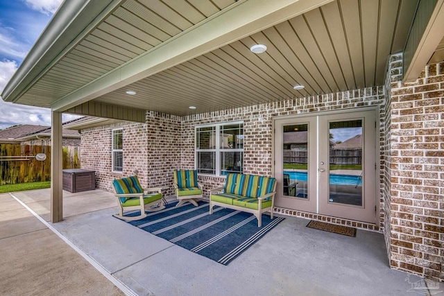 view of patio / terrace with french doors and fence