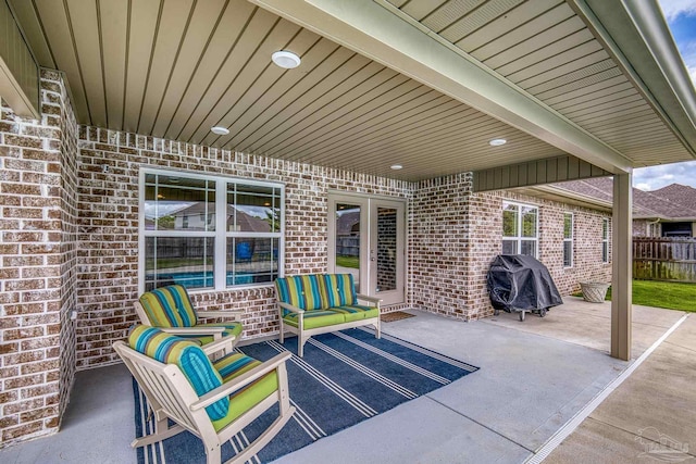 view of patio / terrace featuring grilling area and fence
