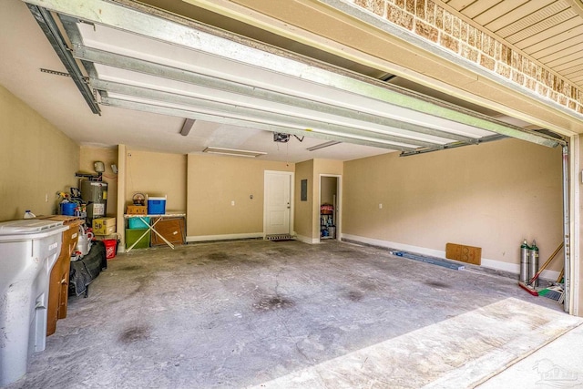 garage featuring electric water heater and a garage door opener
