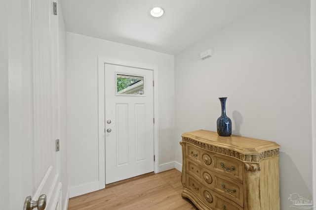 entrance foyer with light wood finished floors and baseboards