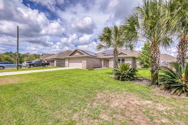 ranch-style home featuring an attached garage, driveway, and solar panels