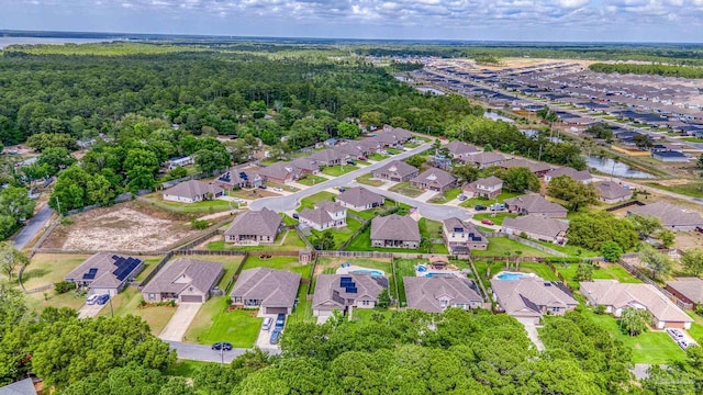 aerial view of property's location featuring nearby suburban area