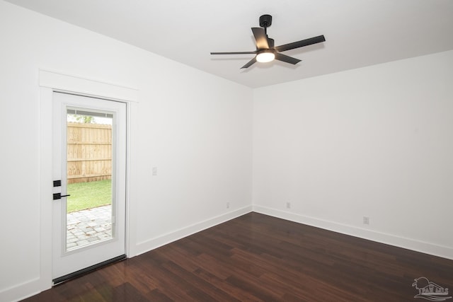 502 W Gregory St, Pensacola, FL 32502 - empty room with dark wood-type flooring, ceiling fan, and baseboards