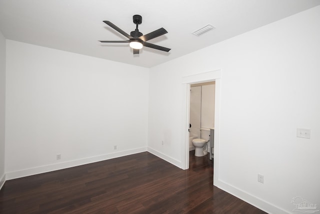 502 W Gregory St, Pensacola, FL 32502 - spare room with ceiling fan, baseboards, and dark wood-style flooring