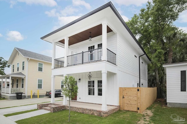 502 W Gregory St, Pensacola, FL 32502 - back of property featuring a balcony, covered porch, and board and batten siding