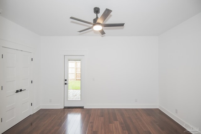 502 W Gregory St, Pensacola, FL 32502 - empty room with dark wood-type flooring, ceiling fan, and baseboards