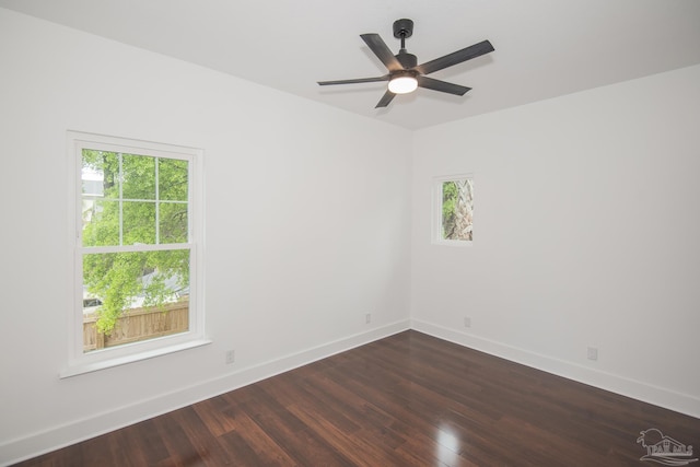 502 W Gregory St, Pensacola, FL 32502 - empty room featuring dark wood-style floors, baseboards, and a ceiling fan
