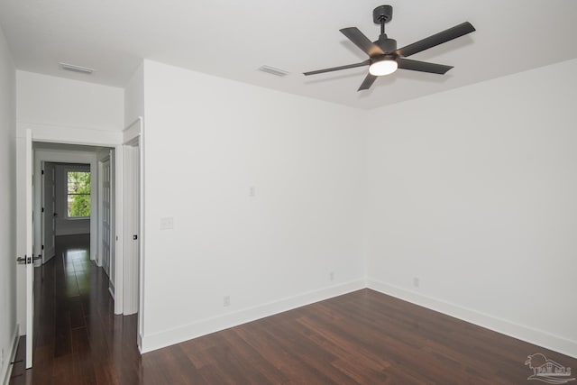 502 W Gregory St, Pensacola, FL 32502 - empty room with dark wood-type flooring, baseboards, and a ceiling fan