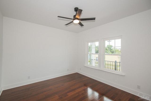 502 W Gregory St, Pensacola, FL 32502 - empty room featuring dark wood-style flooring, baseboards, and a ceiling fan