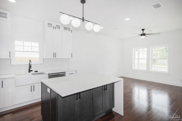 502 W Gregory St, Pensacola, FL 32502 - kitchen with a sink, ceiling fan, white cabinetry, decorative backsplash, and recessed lighting