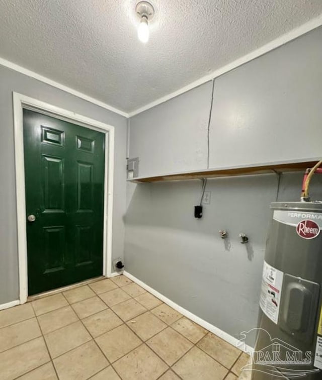 laundry room featuring ornamental molding, electric water heater, light tile patterned floors, and a textured ceiling