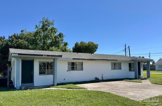 view of front of house with a front lawn and a patio