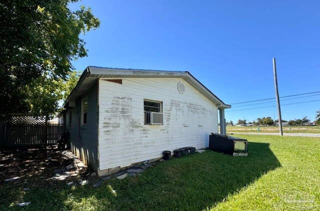 view of home's exterior with a yard