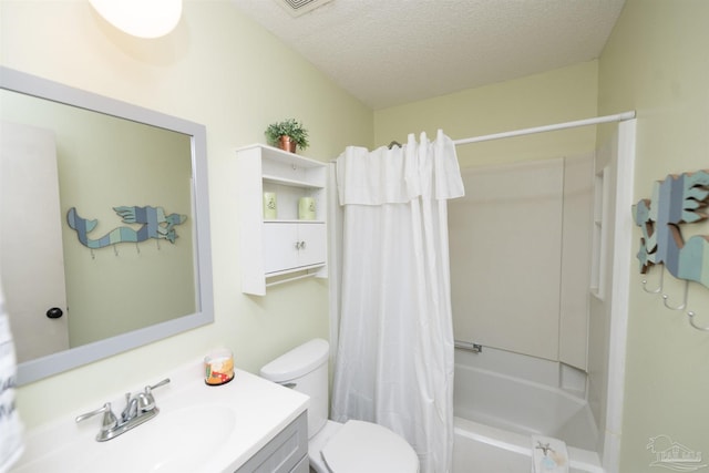 full bathroom featuring toilet, vanity, a textured ceiling, and shower / tub combo