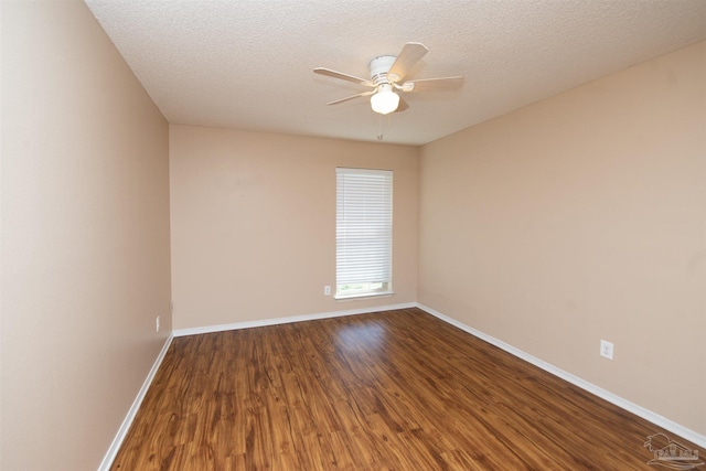 spare room with ceiling fan, wood-type flooring, and a textured ceiling