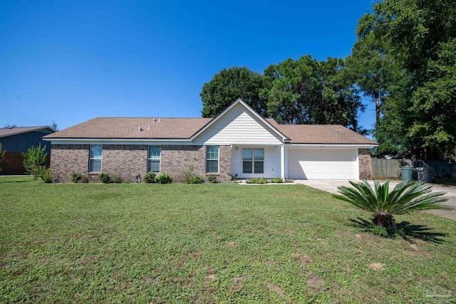 ranch-style home featuring a garage and a front yard