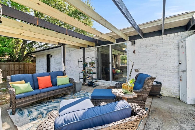 view of patio / terrace with an outdoor living space, a pergola, and fence