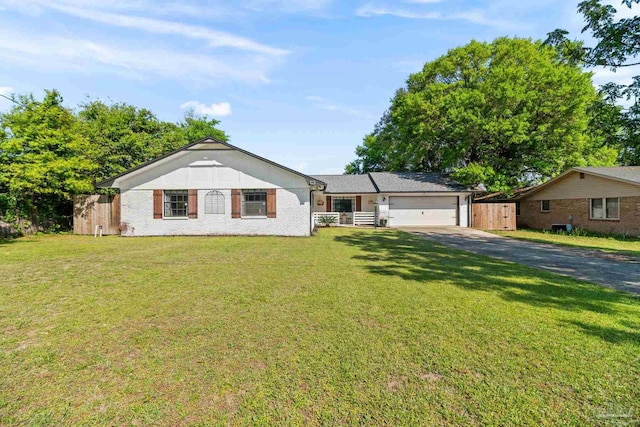 ranch-style house with aphalt driveway, brick siding, a front lawn, and an attached garage