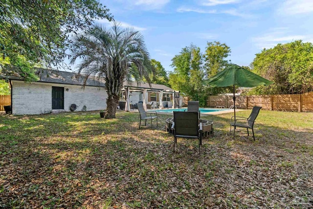 view of yard with a fenced backyard and a fenced in pool