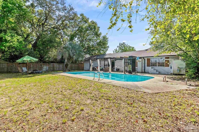 view of swimming pool with a fenced backyard, a fenced in pool, a patio, and a lawn