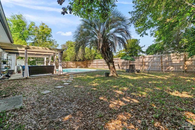 view of yard featuring a patio area, a fenced backyard, and a fenced in pool