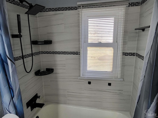 bathroom featuring shower / bathtub combination with curtain