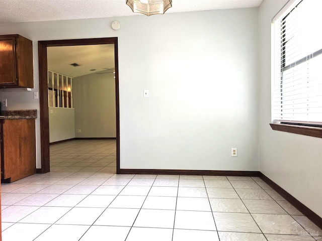 1900 W Kingsfield Rd, Cantonment, FL 32533 - unfurnished room featuring light tile patterned flooring and baseboards
