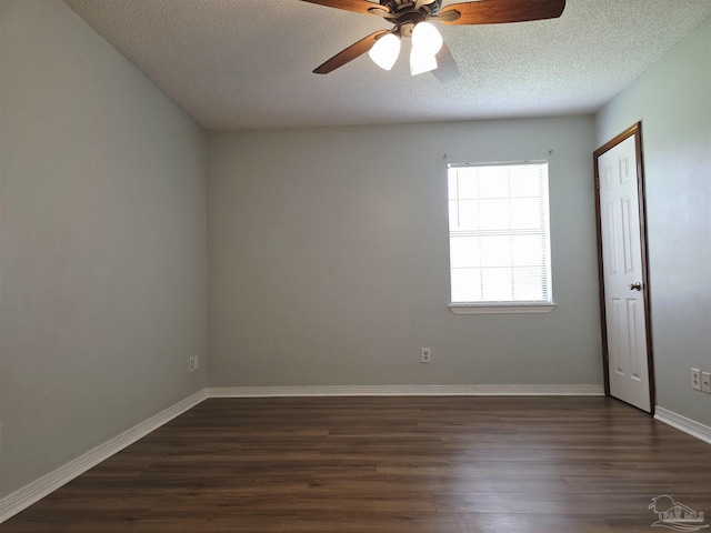 1900 W Kingsfield Rd, Cantonment, FL 32533 - spare room featuring dark wood-type flooring, a ceiling fan, and a textured ceiling