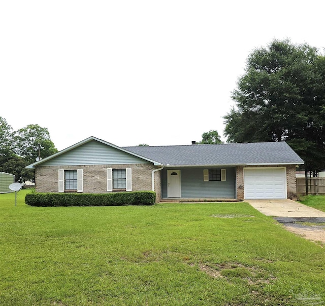 1900 W Kingsfield Rd, Cantonment, FL 32533 - single story home featuring a garage, driveway, brick siding, and a front yard