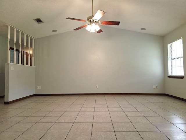 1900 W Kingsfield Rd, Cantonment, FL 32533 - spare room with vaulted ceiling, ceiling fan, and light tile patterned flooring