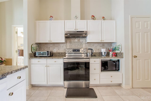 3017 Southsky Ln, Pensacola, FL 32506 - kitchen with under cabinet range hood, stainless steel range with electric cooktop, black microwave, and light tile patterned floors
