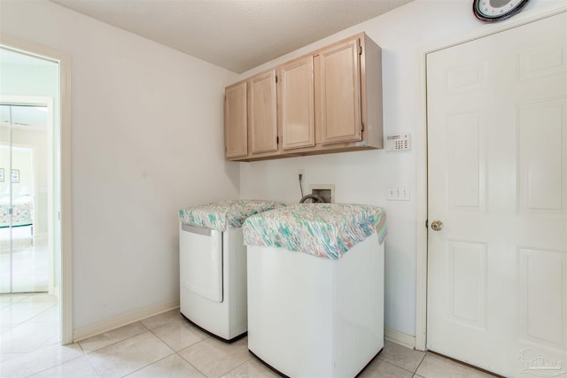 3017 Southsky Ln, Pensacola, FL 32506 - laundry room featuring cabinet space, baseboards, light tile patterned floors, and washer / dryer