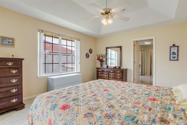 3017 Southsky Ln, Pensacola, FL 32506 - bedroom with a raised ceiling, carpet flooring, baseboards, and ceiling fan
