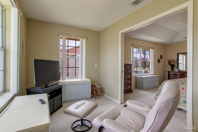 3017 Southsky Ln, Pensacola, FL 32506 - living room with plenty of natural light, light carpet, ceiling fan, and baseboards