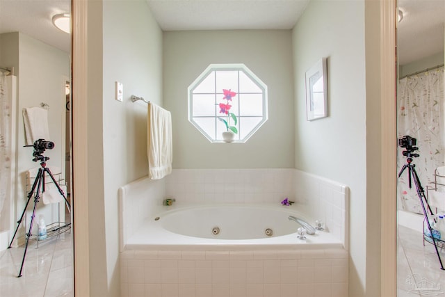3017 Southsky Ln, Pensacola, FL 32506 - bathroom featuring a jetted tub and tile patterned flooring
