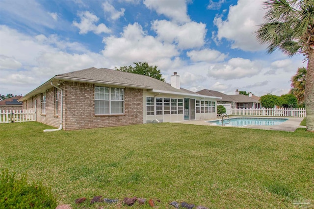 3017 Southsky Ln, Pensacola, FL 32506 - rear view of property featuring a sunroom, a chimney, and brick siding