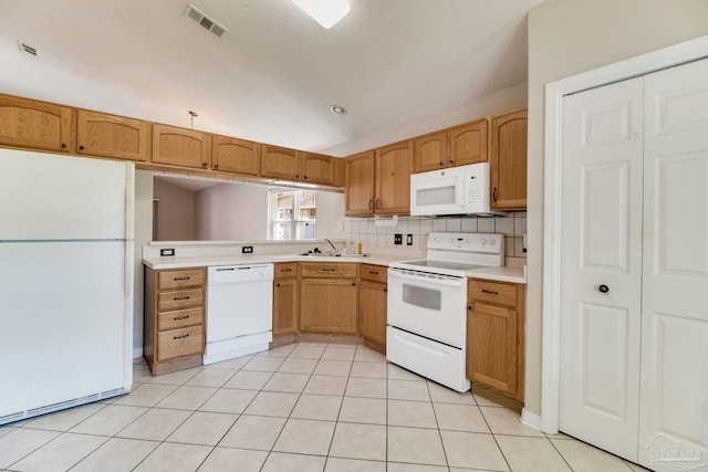 3881 Windsor Castle Blvd, Milton, FL 32583 - kitchen featuring white appliances, light countertops, a sink, decorative backsplash, and light tile patterned flooring