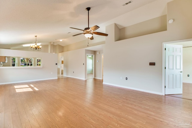 3881 Windsor Castle Blvd, Milton, FL 32583 - unfurnished living room featuring a chandelier, a ceiling fan, light wood finished floors, high vaulted ceiling, and baseboards
