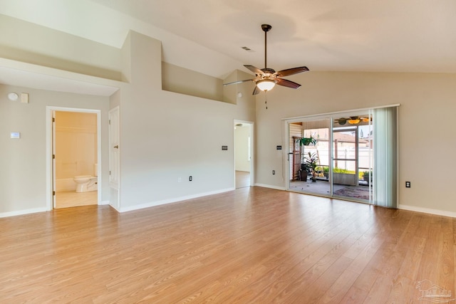 3881 Windsor Castle Blvd, Milton, FL 32583 - unfurnished living room with ceiling fan, light wood-type flooring, baseboards, and high vaulted ceiling