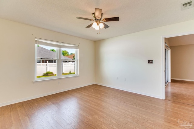 3881 Windsor Castle Blvd, Milton, FL 32583 - spare room featuring light wood-style floors, a ceiling fan, and baseboards